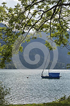 Small sailing yacht on Alpine lake Mondsee, Austria