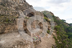 Small sanctuary with offerings to the Virgen del Pilar in the middle of the nature on the ascent to Cabezo del Sillon in Maria de photo