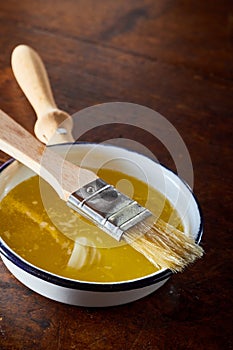 Small saucepan of melted butter for baking