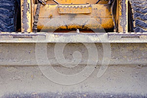 Small scratched bulldozer. construction equipment. fruitful work concept. small tractor after work
