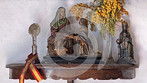 Small sculptures Madonna inside the tasting room of the olive oil mill Molino El Vinculo near Zhahara de la Sierra.