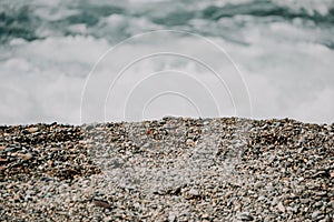 Small sea wave, Blurred Soft foamy waves washing golden sandy beach on sunset. Ocean Waves On Sandy Beach. Nobody