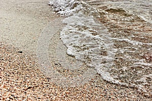 A small sea wave with foam.