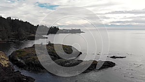 A small seaside condo development situated on the edge of a cliff overlooking the Pacific Ocean, Sooke, BC. - 4K 24FPS