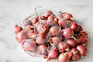 small shallots on a light background