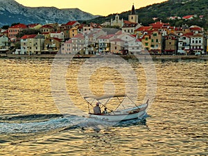 Small ship on sunset