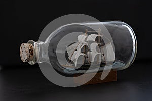 Small ship model in a bottle with a cork stopper