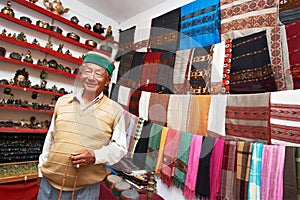 Small shop owner indian man at his souvenir store