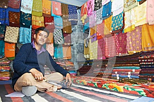 Small shop owner indian man at his souvenir store