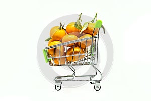 small shopping cart with many clementines and tangerines
