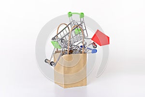Small shopping carts in Paper bag. Sales and Internet online shopping concept