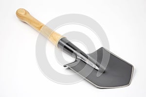 Small shovel for tourism and earthworks on a white background