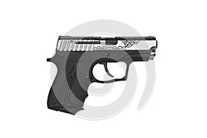 A small silver-black pistol with a pattern on the body. Gift weapon isolate on white background