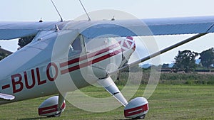 A small single engine aircraft taxis to an airfield