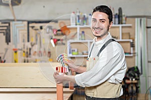 Small-Sized Companies, furniture and worker concept - Handsome young man working in the furniture factory