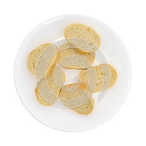 Small sliced French bread on a white plate