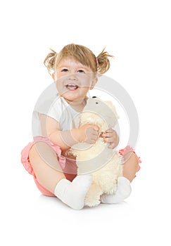 Small smiling girl with toy bear