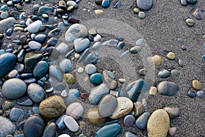 Small and smooth waterworn black pebble use for garden decoratio