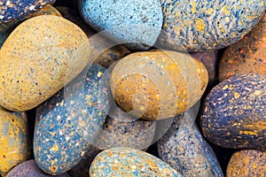 small smooth waterworn black pebbles or stones for use decor and garden landscaping. tone garden interiors. stone spa