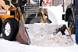 Small snow plow tractor. Snow Cleaner. Winter road works