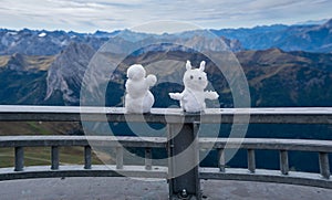 The small snowmen on the iron fence of Sass Pordoi Terrazza Delle Dolomiti