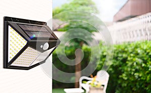 Small solar powered led light with motion sensor