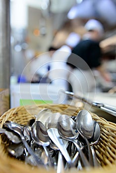 Small spoons in the kitchen of a restaurant