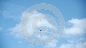 Small sport airplane flying in the background of blue sky, view from below, clear blue sky in background