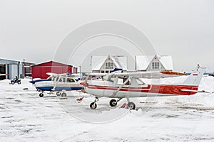 Small sport planes parked in a small airport