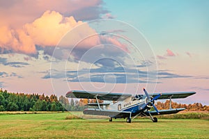 A small sports aircraft parked at the airfield