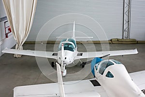 Small sports airplanes in a hangar