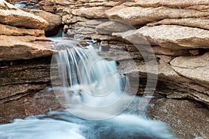 Small springtime waterfall in desert mountains