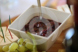 Small square bowl with home made cherry preserves
