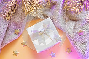A small square gift with a bow close-up.