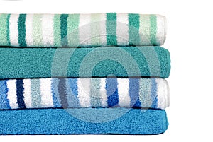 Small stack of beach or bathroom towels isolated on white background photo