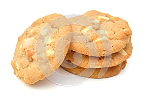 A small stack of macadamia nut and white chocolate cookies. 