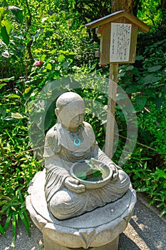 Small statue of Buddhist figure in Japanese Temple