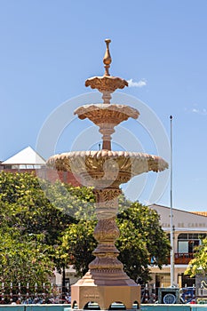 Small statue of gold-colored basin, placed in the main square of Carhuaz, Ancash - Peru