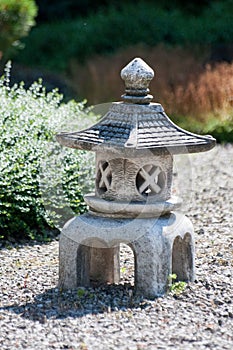Small statuette resembling tower made of stone