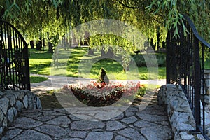 Small stone bridge in  the park during the  summer season.Beautiful natura.