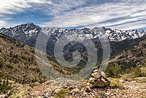 Small stone cairn and Asco mountains in Corsica