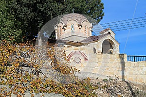 Small stone orthodox church on the hill in the countryside