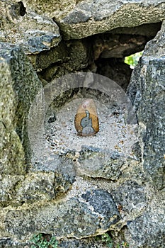 Small stone with painted elephant in the rocky hole