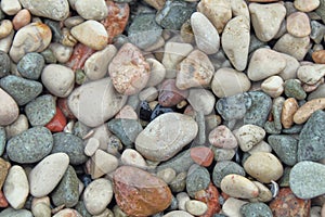 Small stone pebbles. textured stones with each other, attract the eye and soothe