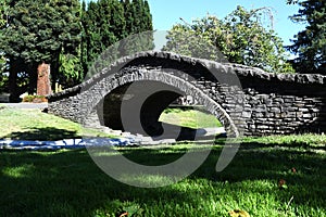 Small Stone viaduct bridge in a local park across small river in Santa Rosa, California