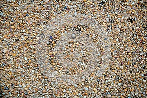 Small stones on concrete wall