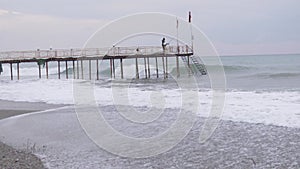 A small storm at sea at the pier