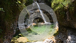 A small stream creates a small waterfall