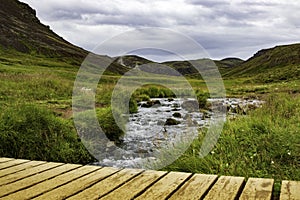 Small Stream Flowing Through Geothermal Valley in Iceland