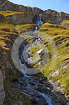 A small stream flows down the mountainside